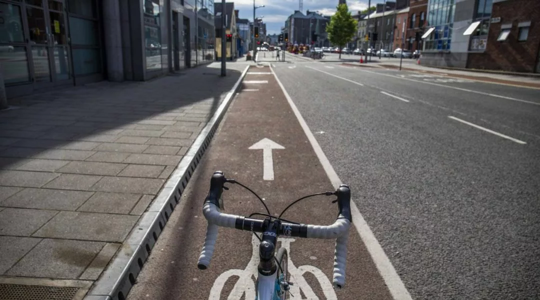 Cycle routes A photo taken from the seat of a bike looking forward, as it sits in a cycle lane.
