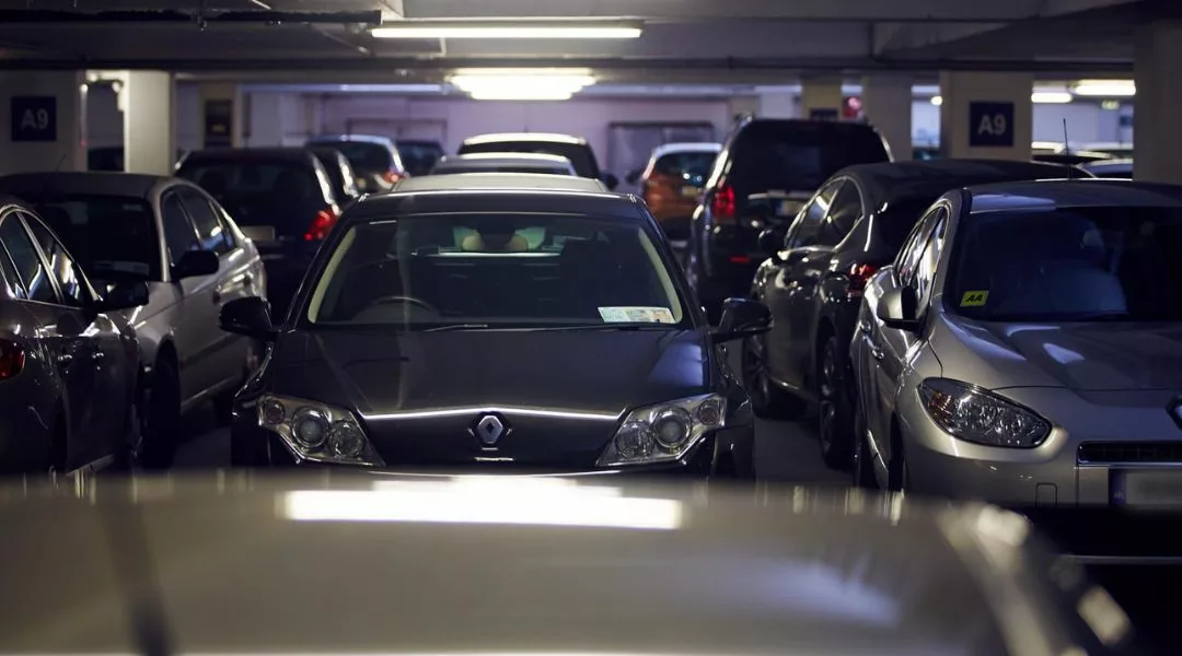 A photo of parked cars in a car park.