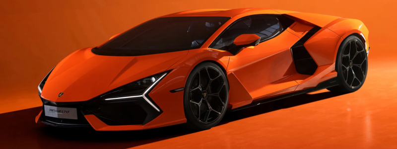 The 2024 Lamborghini Revuelto in bright orange against a similar orange background.