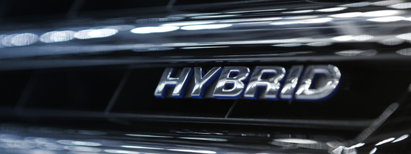 The word 'hybrid' marked onto a car.