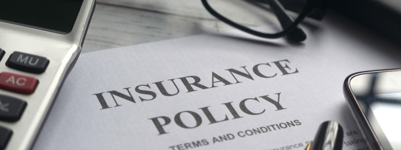A close up of an insurance policy on paper.