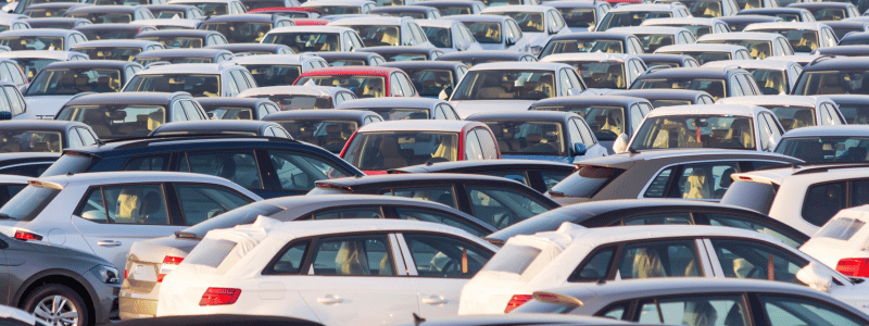 Car Lot (3) (1) A lot of hundreds of cars, with the tops of the cars visible.