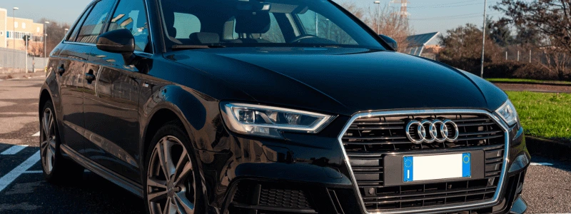 Audi A1 Black (1) A close up of a black Audi A1 in a built up area.