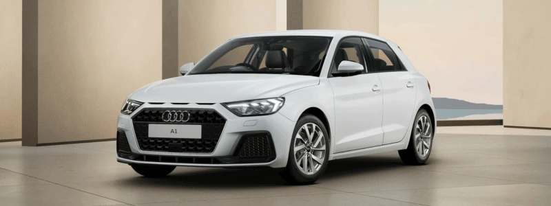 Audi A1 Sportback 2025 (1) A white Audi A1 Sportback parked in front of slabs, likely a futuristic abstract setting.