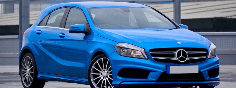 Blue Mercedes (1) A blue Mercedes A Class parked in an industrial setting.