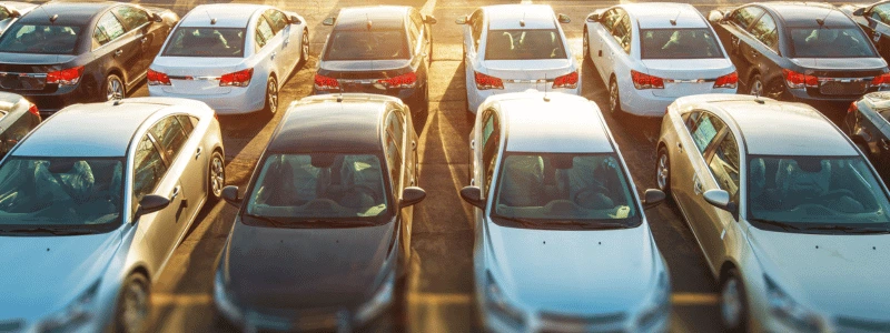Car Rows Overhead (1) An overhead shot of two rows of cars, with sun shining down.