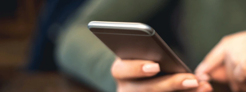 A close up of someone using a mobile device.