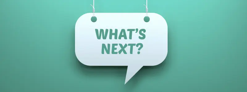 A green background with a sign over the top reading 'WHAT'S NEXT?'