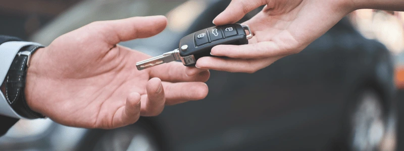 Car keys being handed over.