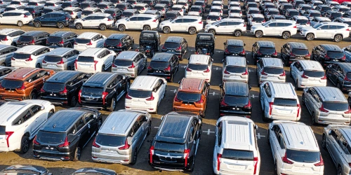 An overhead shot of a large car lot.