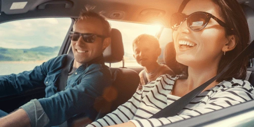 A happy family in a car.