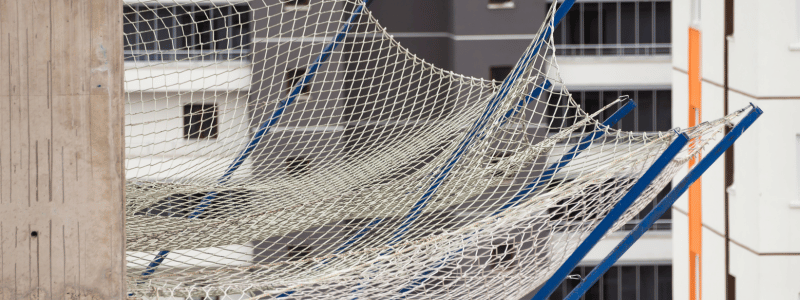 A safety net hanging off a building.