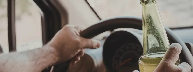 A person drink driving.