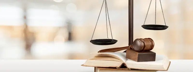 Law objects, including scales and a book.