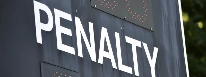A sign displaying 'PENALTY'.