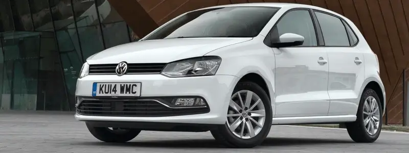 A white VW Polo parked up.