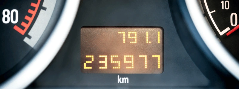 A close up of a mileage counter in kms.