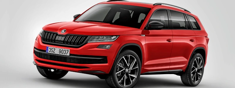 A red Skoda Kodiaq side on.