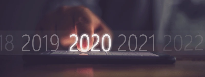 The years 2018-2022 blurred out with a hand selecting 2020.